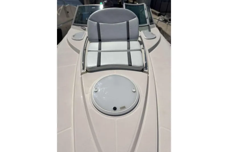 Slide: The Image of 2014 Monterey 320 Sport Yacht bow with cushioned seating and hatch. - 15