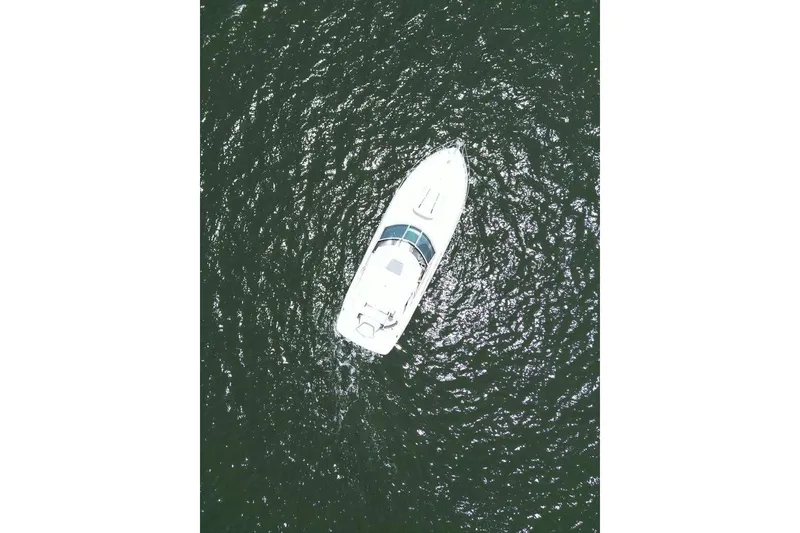 Slide: The Image of Aerial view of 2014 Monterey 320 Sport Yacht on open water. - 3