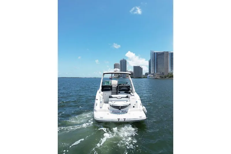 Slide: The Image of 2014 Monterey 320 Sport Yacht cruising near city skyline on a sunny day. - 8