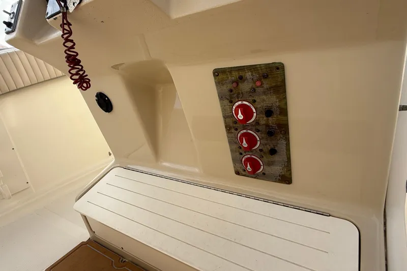 Slide: The Image of 2006 Scout 260 Sportfish boat interior with control panel and seating area. - 16