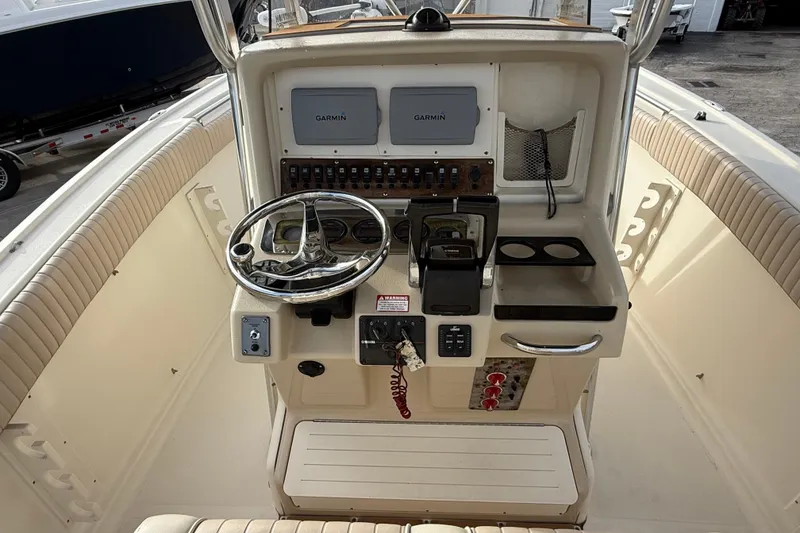 Slide: The Image of 2006 Scout 260 Sportfish boat console with Garmin navigation and steering wheel. - 17