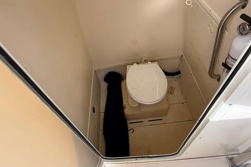 Slide: The Image of 2006 Scout 260 Sportfish boat interior with toilet and fire extinguisher. - 20