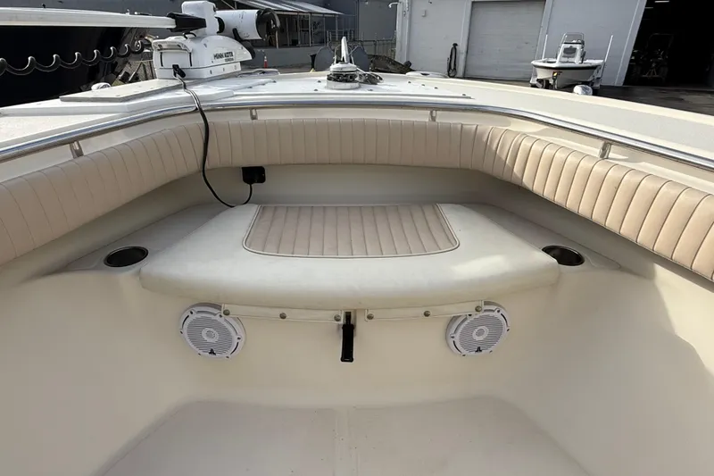 Slide: The Image of 2006 Scout 260 Sportfish boat interior with cushioned seating and speakers. - 22