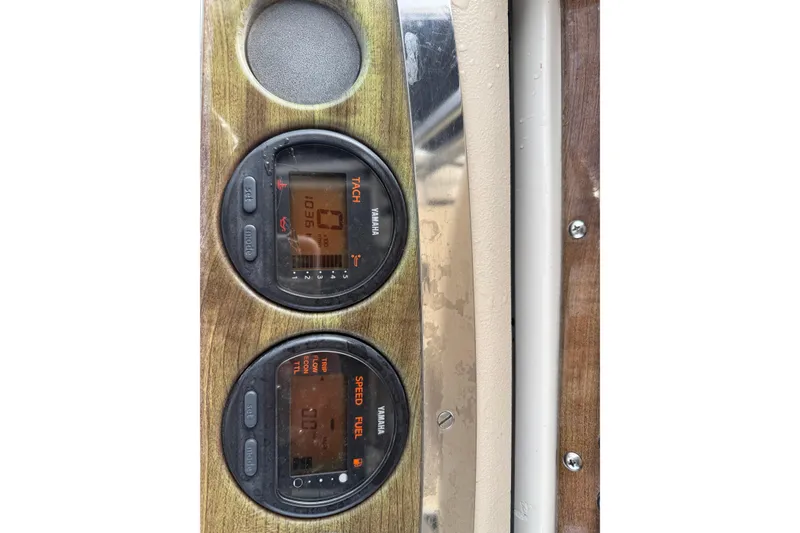 Slide: The Image of Dashboard of 2006 Scout 260 Sportfish with Yamaha tachometer and speed fuel gauges. - 26