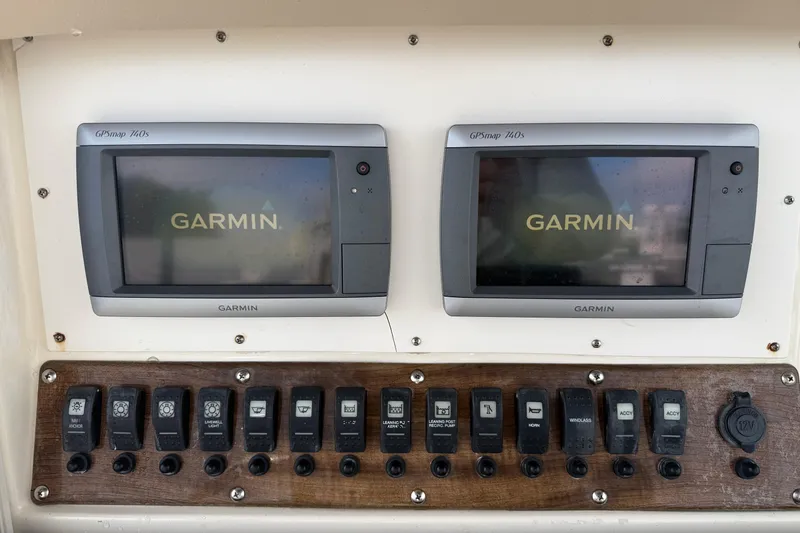 Slide: The Image of Control panel of a 2006 Scout 260 Sportfish with dual Garmin GPS displays. - 27