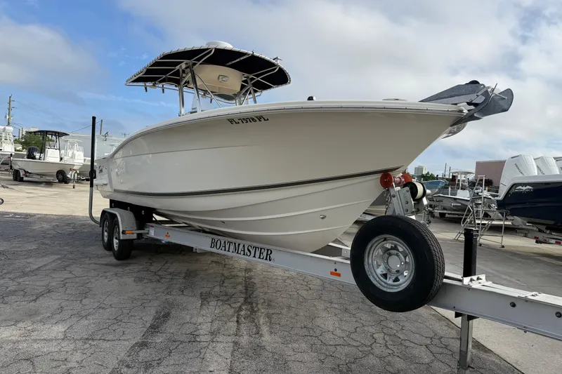 Slide: The Image of 2006 Scout 260 Sportfish boat on trailer in marina setting. - 3