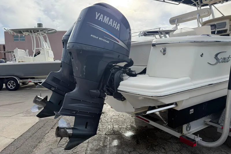 Slide: The Image of 2006 Scout 260 Sportfish with Yamaha outboard motors, parked on a trailer. - 5