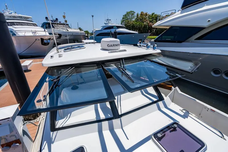Slide: The Image of 2024 MJM 4 Yacht with open windows at the marina. - 13