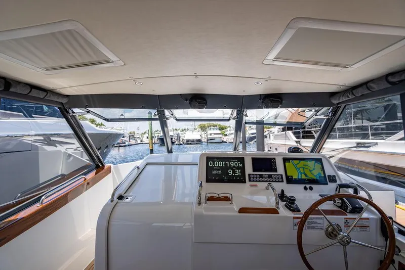 Slide: The Image of Interior view of 2024 MJM 4 boat cockpit with modern navigation. - 14