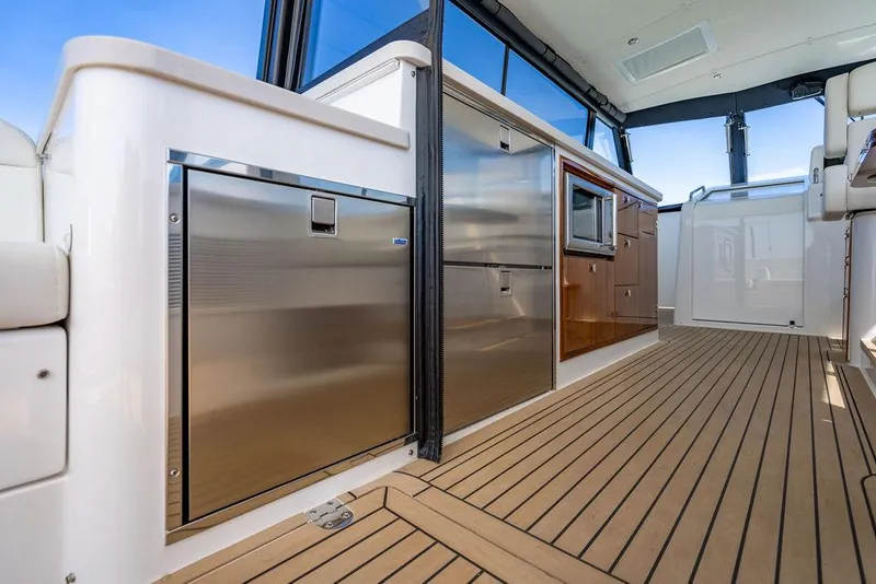 Slide: The Image of 2024 MJM 4 yacht interior with sleek kitchen and modern appliances. - 28