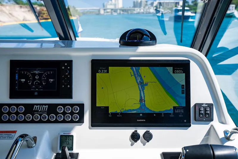 Slide: The Image of Navigation system on a 2024 MJM 4 boat overlooking the water. - 41