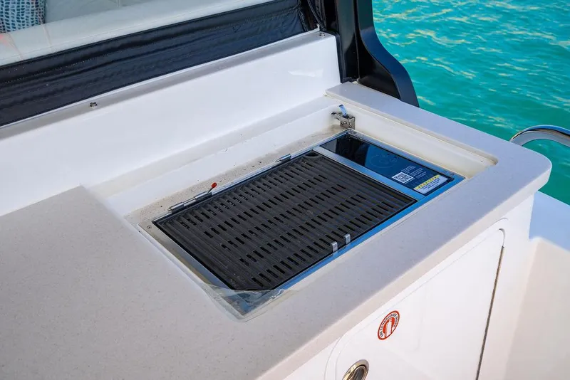 Slide: The Image of 2024 MJM 4 boat with built-in grill on deck. - 48