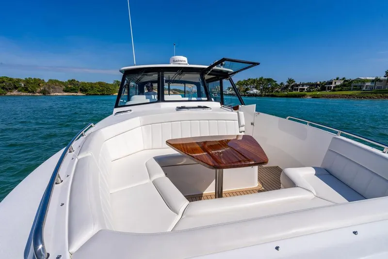 Slide: The Image of 2024 MJM 4 yacht with luxurious deck and seating area. - 8