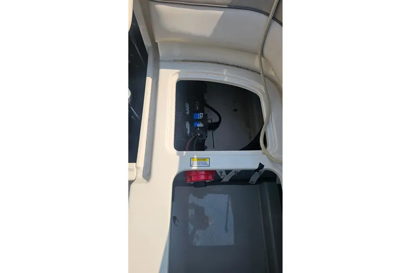 Slide: The Image of Open storage compartment in 2003 Sea Ray 220 Sundeck boat. - 16