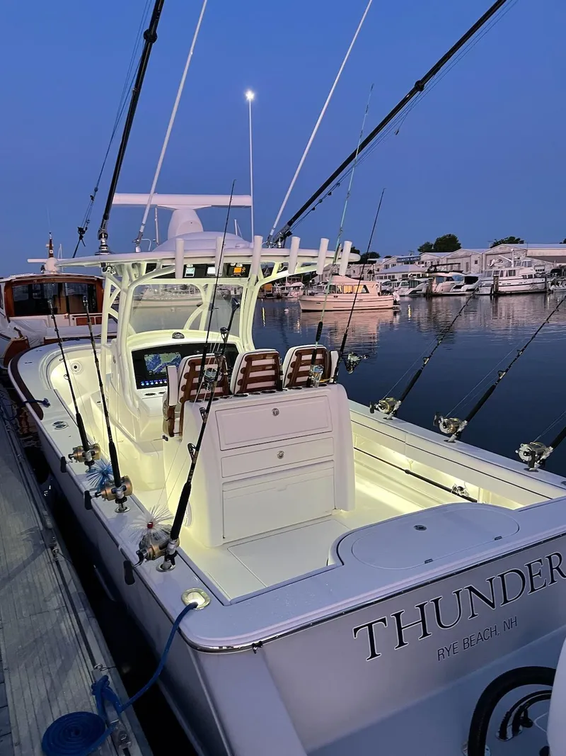 Slide: The Image of 2022 Valhalla V-33 Center Console boat docked at marina during evening. - 11