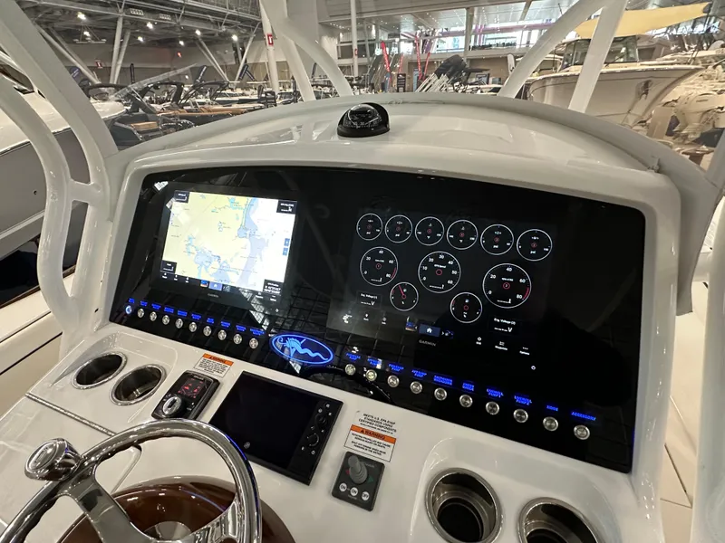 Slide: The Image of 2022 Valhalla V-33 Center Console dashboard with navigation and control displays. - 13