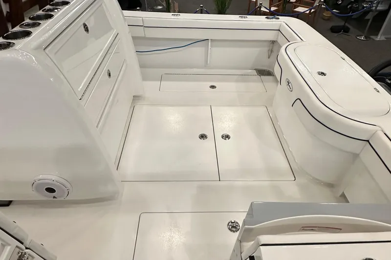 Slide: The Image of 2022 Valhalla V-33 Center Console boat interior with storage compartments and seating. - 22