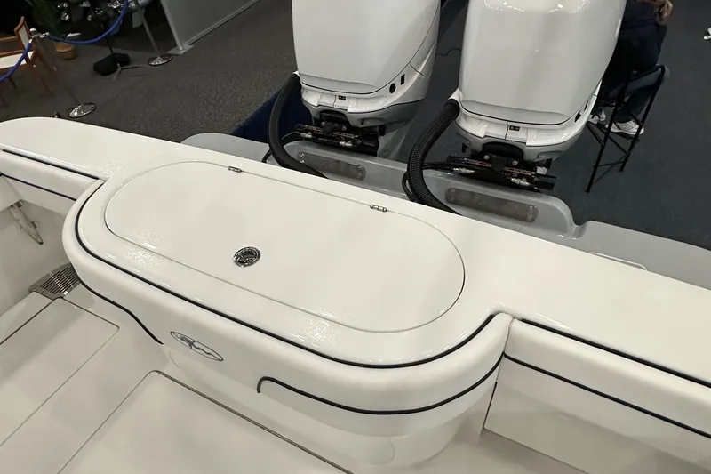 Slide: The Image of 2022 Valhalla V-33 Center Console boat with dual outboard engines, sleek white design. - 23