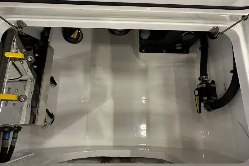 Slide: The Image of 2022 Valhalla V-33 Center Console storage compartment with mechanical components. - 24