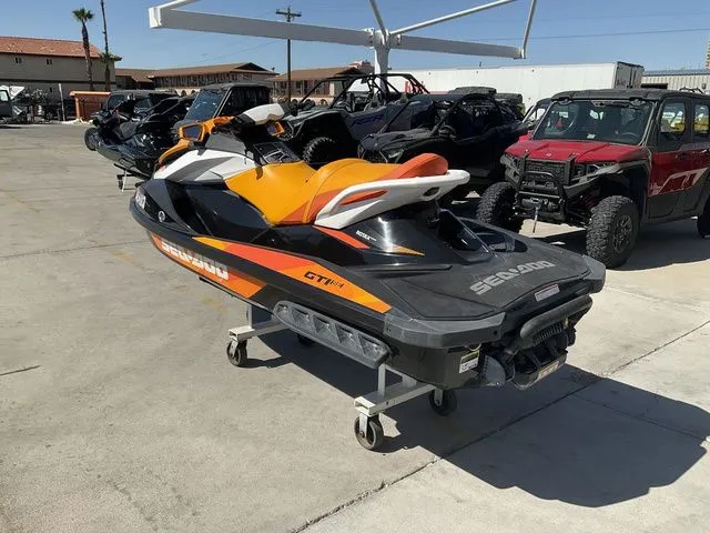 Slide: The Image of 2018 Sea-Doo GTI jet ski parked outdoors. - 4