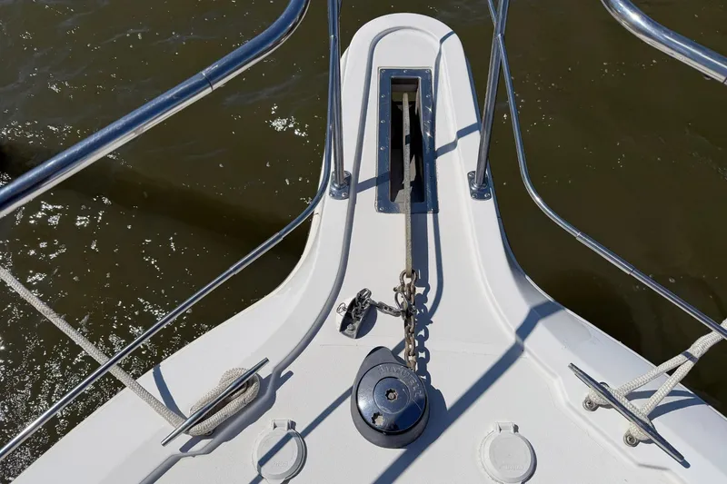Slide: The Image of Bow of 1997 Carver 400 Cockpit Motor Yacht with anchor chain and railing. - 10