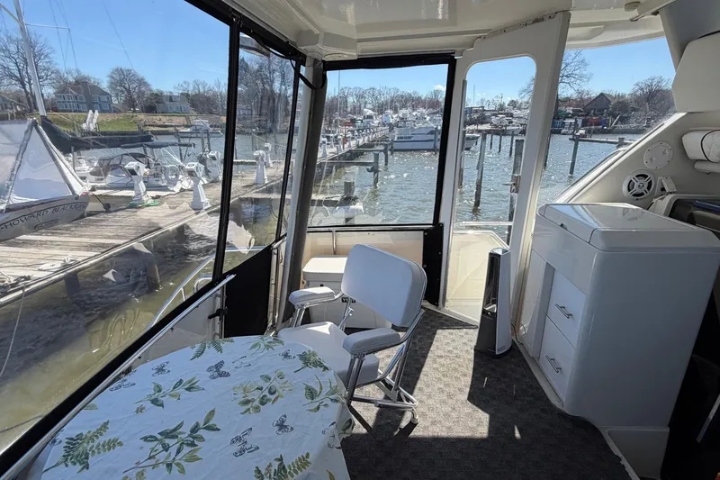 Slide: The Image of Interior view of 1997 Carver 400 Cockpit Motor Yacht at marina. - 14