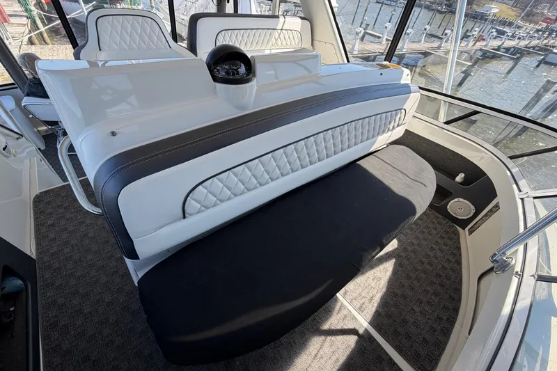 Slide: The Image of Interior of 1997 Carver 400 Cockpit Motor Yacht with stylish seating and helm. - 25