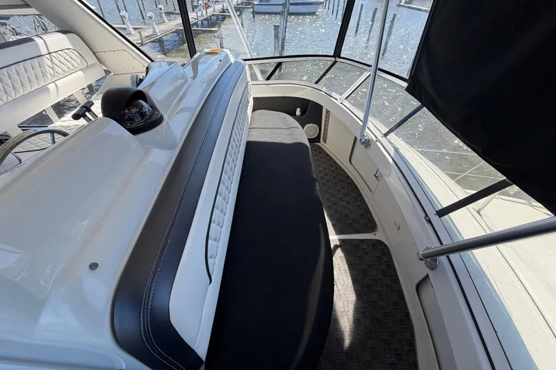 Slide: The Image of 1997 Carver 400 Cockpit Motor Yacht interior with helm and seating area. - 26
