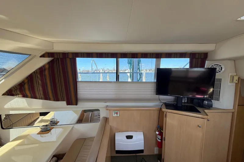 Slide: The Image of Interior of 1997 Carver 400 Cockpit Motor Yacht with TV and window view. - 30