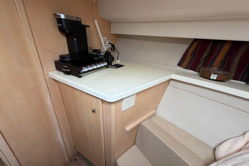 Slide: The Image of 1997 Carver 400 Cockpit Motor Yacht interior with coffee maker on counter. - 39