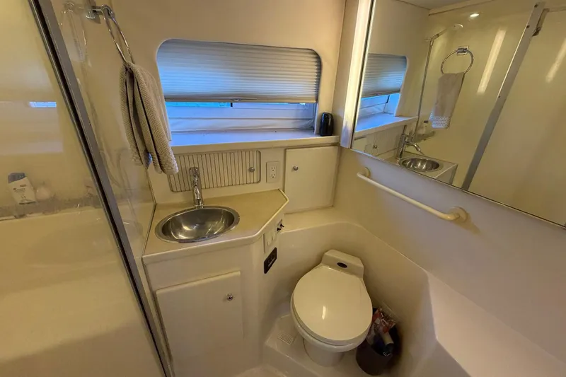 Slide: The Image of Bathroom interior of 1997 Carver 400 Cockpit Motor Yacht with sink and toilet. - 45