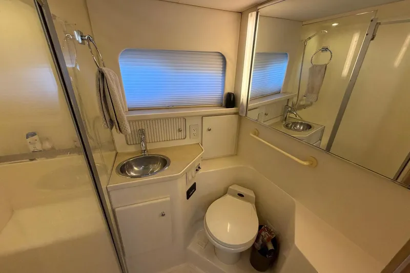 Slide: The Image of Bathroom interior of 1997 Carver 400 Cockpit Motor Yacht with sink and toilet. - 46