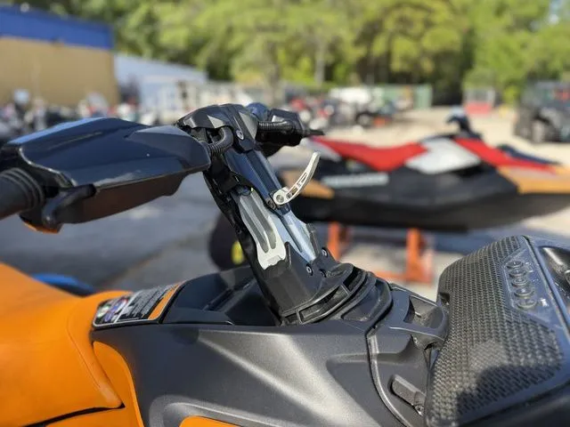 Slide: The Image of Close-up of a 2026 Sea-Doo SparkTrixx jet ski, orange and black. - 10