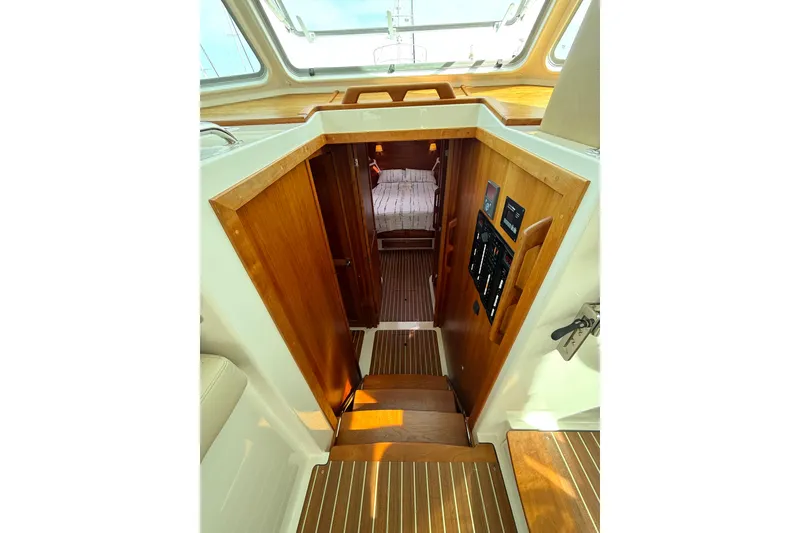 Slide: The Image of Interior view of 2018 Back Cove 41 yacht, featuring wooden stairs and cabin entrance. - 12