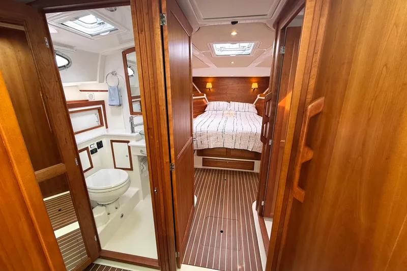 Slide: The Image of Luxurious 2018 Back Cove 41 yacht interior with cozy bedroom and elegant bathroom. - 13