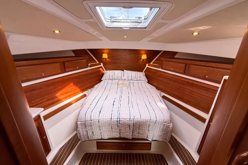 Slide: The Image of Luxurious cabin interior of 2018 Back Cove 41 yacht with cozy bed and wooden accents. - 14