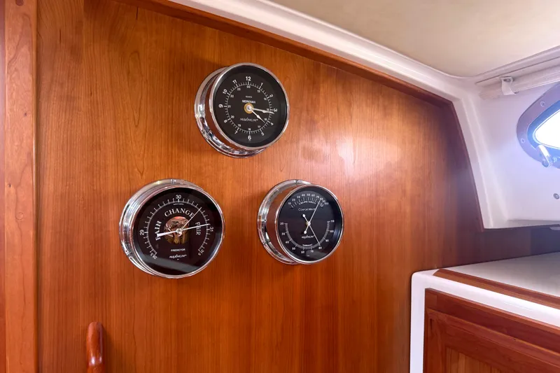 Slide: The Image of Wooden interior of 2018 Back Cove 41 yacht with nautical instruments on display. - 17