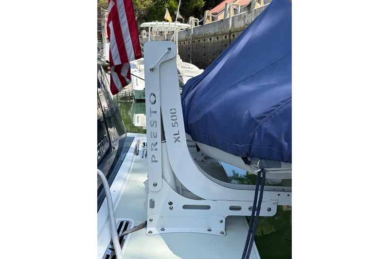 Slide: The Image of 2018 Back Cove 41 boat with Presto XL 500 davit system, docked with American flag. - 27