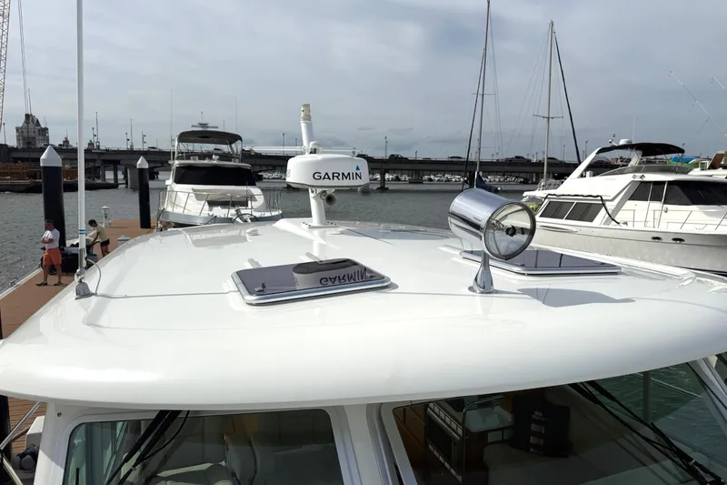 Slide: The Image of 2018 Back Cove 41 yacht docked, featuring Garmin equipment and sleek design. - 30