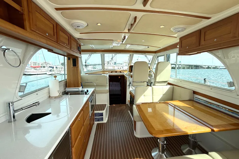 Slide: The Image of Luxurious interior of a 2018 Back Cove 41 yacht with elegant wood finishes and spacious seating. - 6