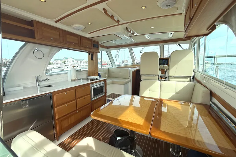 Slide: The Image of Luxurious interior of 2018 Back Cove 41 yacht with modern kitchen and seating area. - 7