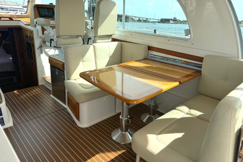 Slide: The Image of Luxurious interior of 2018 Back Cove 41 yacht with elegant seating and wooden table. - 8
