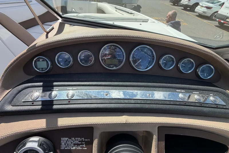 Slide: The Image of Dashboard of a 2014 Cobalt 210 boat with gauges and controls. - 11