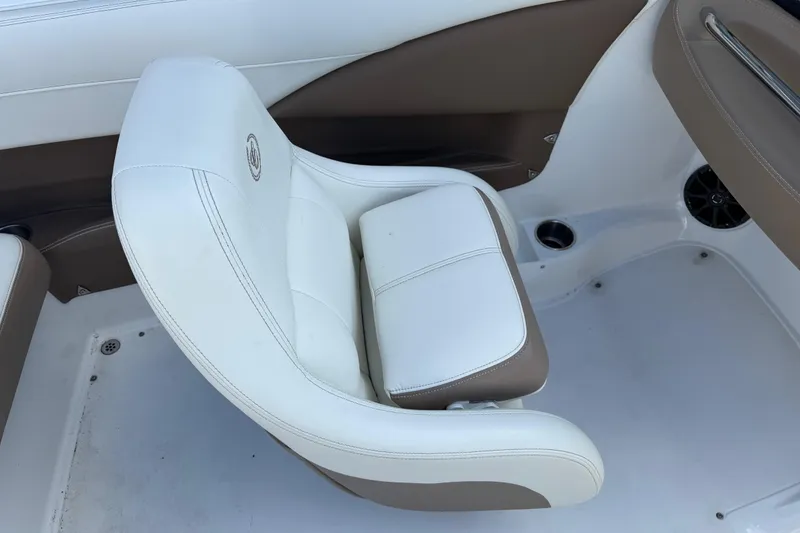 Slide: The Image of White and brown seat in a 2014 Cobalt 210 boat interior. - 8