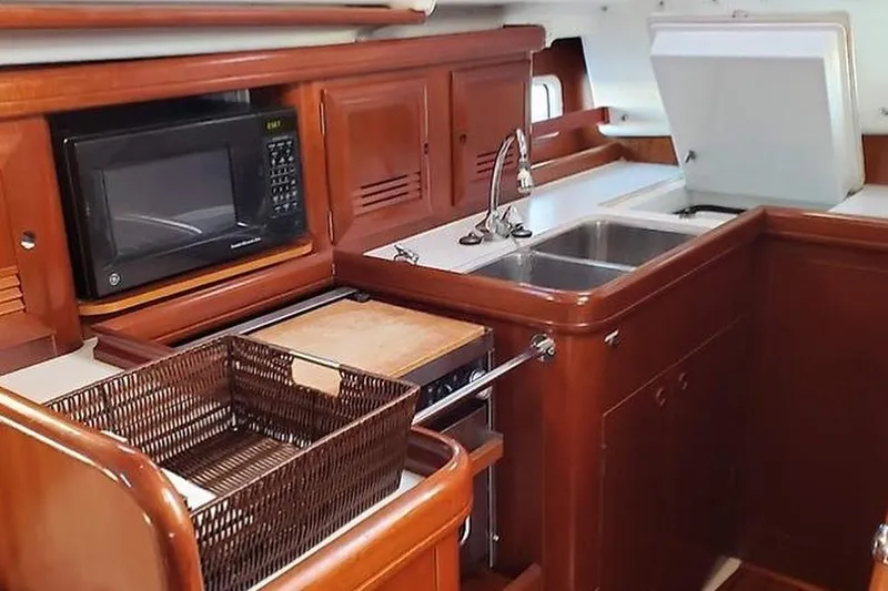 Slide: The Image of Galley kitchen in 2002 Beneteau Oceanis Clipper 411 yacht with microwave and sink. - 5
