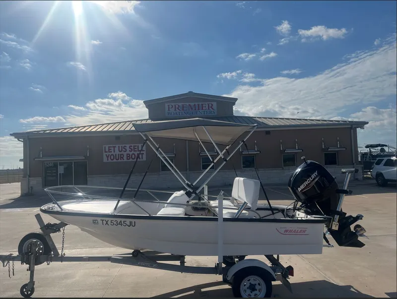 The Image of 2002 Boston Whaler 130 Sport in front of Premier Boating Center. - 1