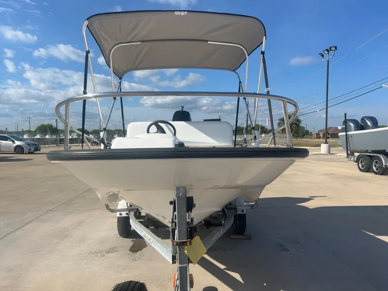 Slide: The Image of 2002 Boston Whaler 130 Sport boat on trailer, sunny day. - 5