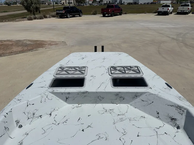 Slide: The Image of 2026 Shoalwater 20' Catamaran on parking lot, front view. - 14