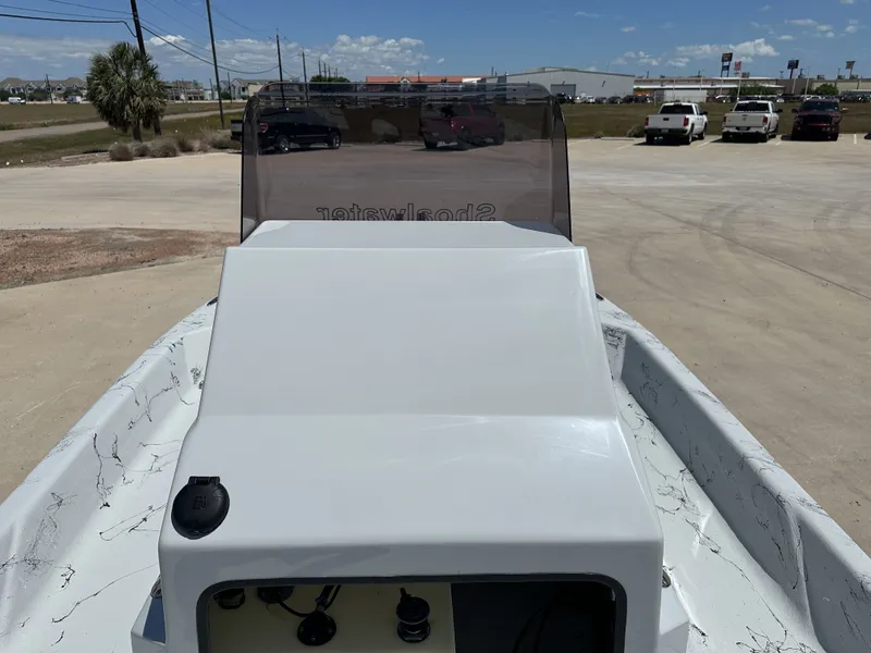 Slide: The Image of 2026 Shoalwater 20' Catamaran on a sunny parking lot. - 22