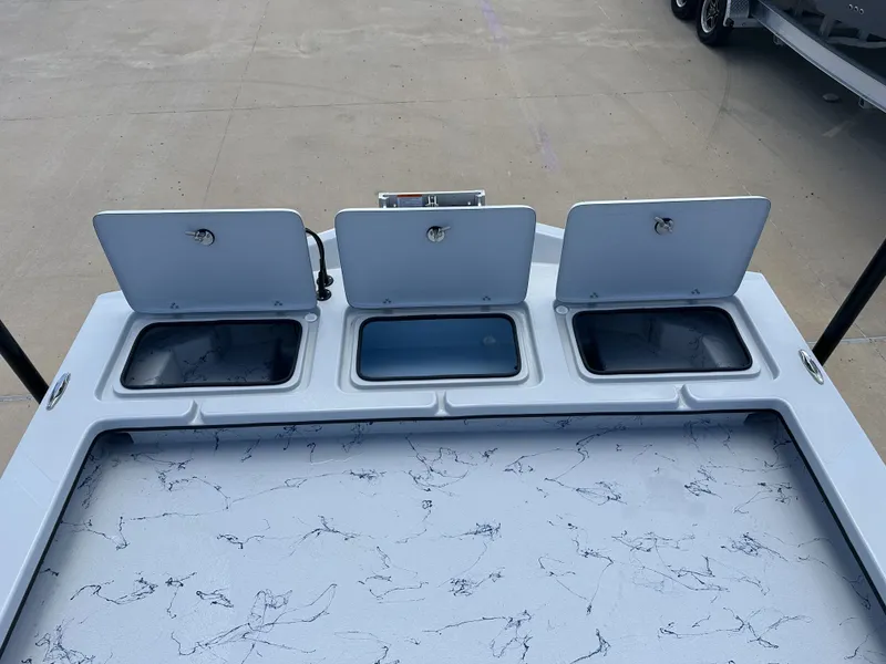 Slide: The Image of 2026 Shoalwater 23' Catamaran with open storage compartments on deck. - 18